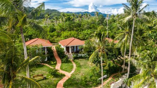 an aerial view of a resort with palm trees at Island View Beachfront Resort in Anda