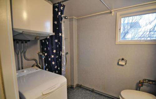 a bathroom with a toilet and a shower curtain with stars at 2 Bedroom Stunning Home In Rnnng in Rönnäng