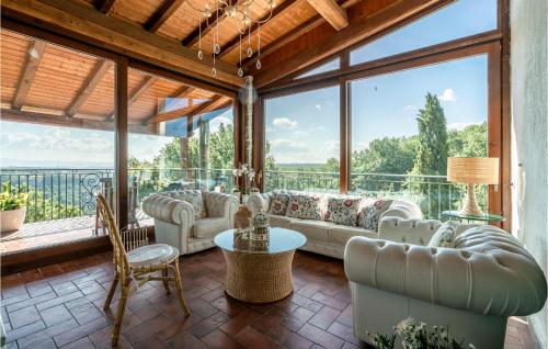 a large living room with a large window at Villa Luca in Vitorchiano