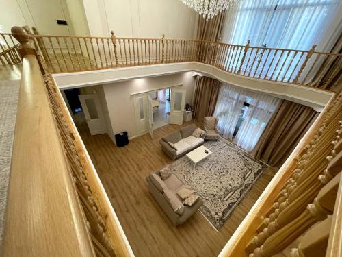 an overhead view of a living room with a staircase at Mountain Garden & SPA in Besqaynar