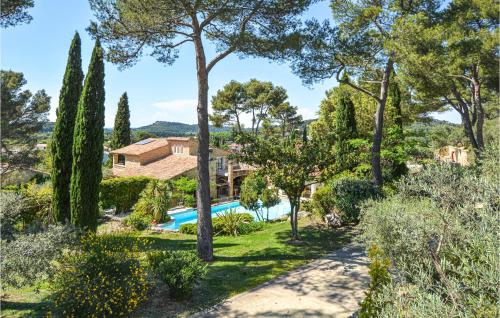a villa with a swimming pool and trees at Nice Home In Orgon With Private Swimming Pool, Can Be Inside Or Outside in Orgon