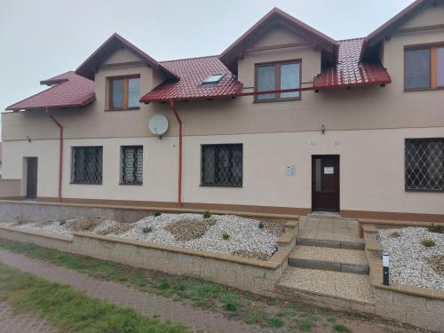 a house with some stairs in front of it at Penzion TOŠA in Klášterec nad Ohří