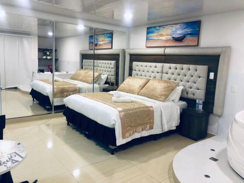 Postel nebo postele na pokoji v ubytování Hotel San Antonio Guarne