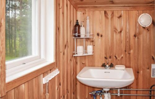 a bathroom with a sink and a window at Two-Bedroom Holiday Home In Nassjo in Nässjö