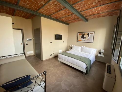 a bedroom with a bed in a room at Cascina Mora Bassa in Vigevano