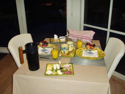 a table with a plate of food on it at B&B Vallis Dyliae in Korbeek-Dijle