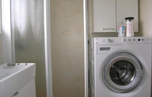 a white washing machine in a small bathroom at 3 Bedroom Stunning Home In Annerstad in Annerstad