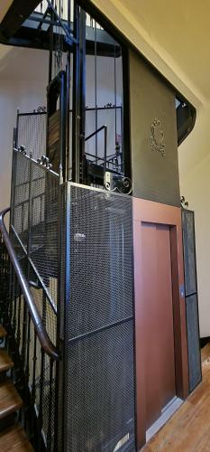 a room with a gate and a staircase with a door at Balcón del Puerto Luxury Suite - VUT-3921-AS in Gijón
