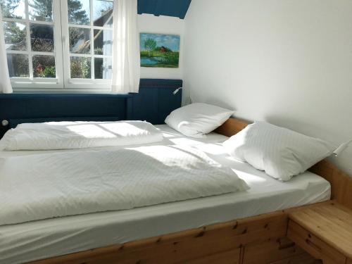Katil atau katil-katil dalam bilik di Ferienwohnung *Reetblick*
