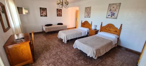 Postel nebo postele na pokoji v ubytování Complejo Turistico la Pinada