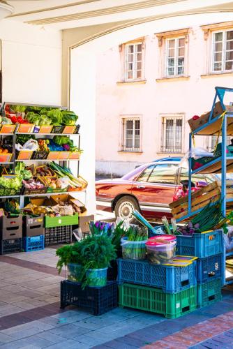 a fruit and vegetable stand with vegetables on display at MARIENSZTAT 8 Aparthotel in Warsaw