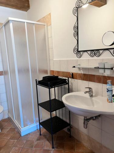 a bathroom with a sink and a shower at Casa Onda in Senigallia