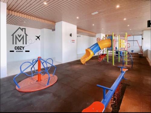 a play room with a slide and a playground at Atlantis Premium 3BDR 4-12pax/5 min to jonker/town in Malacca