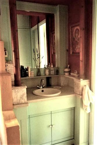 a bathroom with a sink and a mirror at Villa Rodialos in Panormos Rethymno