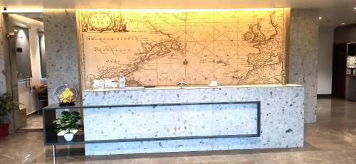 a large map on a wall in a lobby at Hotel Marine House in Agra