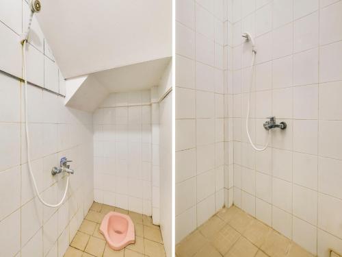 a bathroom with a pink toilet and a shower at SPOT ON 2451 Camel Residence in Semarang
