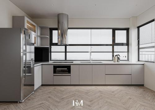 a kitchen with white cabinets and a large window at Marina Golfview in Ðố Sơn