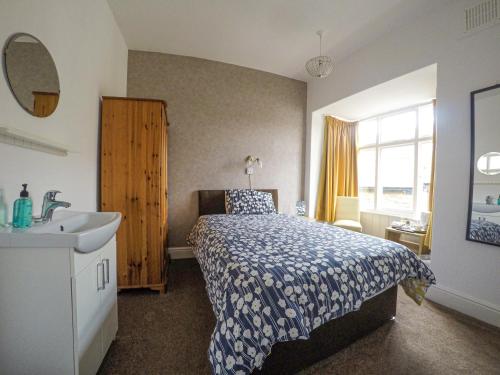 Ένα ή περισσότερα κρεβάτια σε δωμάτιο στο Ashdale Guest House