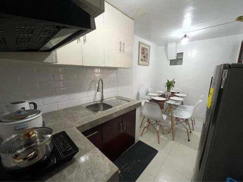 Virtuvė arba virtuvėlė apgyvendinimo įstaigoje La Colmena Bauan - Self Catering Townhouse Accommodation