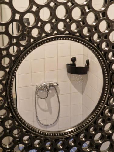 a mirror in a bathroom with a shower at Valdemarin Rural in Orcera