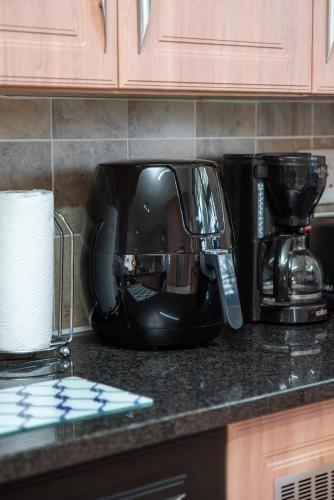 a mixer sitting on a counter in a kitchen at Settle inn Self Catering Units in Colchester