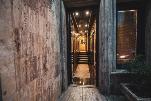 an empty hallway with stairs leading into a building at Hotel Premium in Pristina