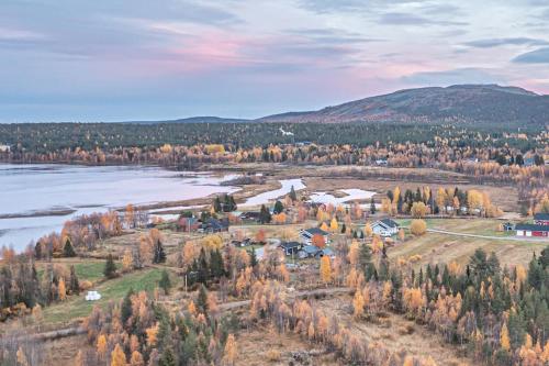 an aerial view of a town next to a lake at Levi Nietos in Kittilä