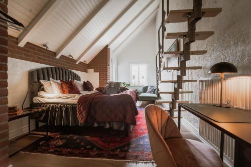 a bedroom with a bed in a brick wall at Villa Brunnby in Mölle