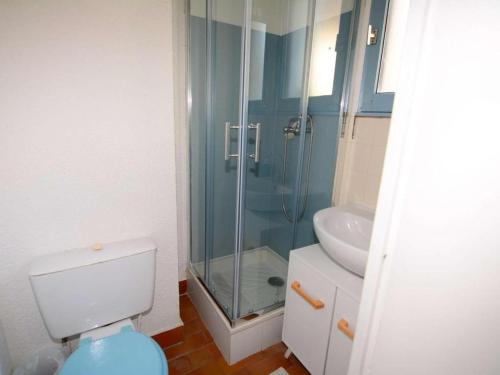 a bathroom with a shower and a toilet and a sink at Agréable studio Barcares in Le Barcarès
