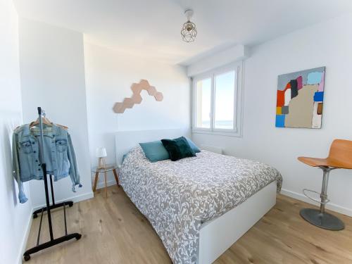Ένα ή περισσότερα κρεβάτια σε δωμάτιο στο Appartement en bord de mer avec vue exceptionnelle