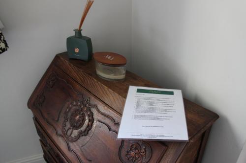 a wooden table with a sign on top of it at Puur B&B in Antwerp