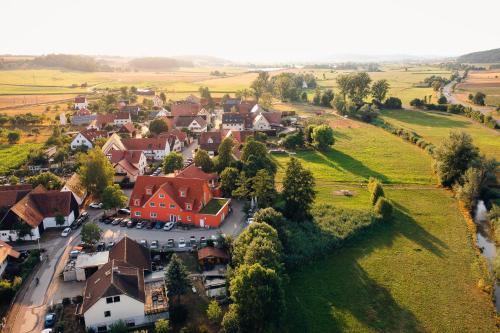 an aerial view of a small village with a red house at Landgasthof Schwarzes Roß in Ansbach