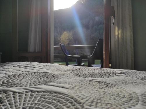 Ένα ή περισσότερα κρεβάτια σε δωμάτιο στο Snö Hotel Bielsa
