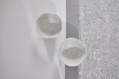 a pair of shower heads on the side of a shower curtain at Kalergis Studios in Naxos Chora
