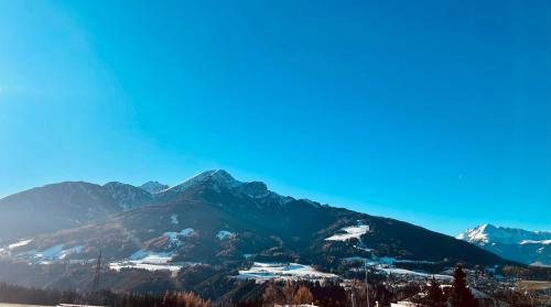 a view of a mountain range with snow at Hotel Sonnenhof - bed & breakfast & appartements in Innsbruck