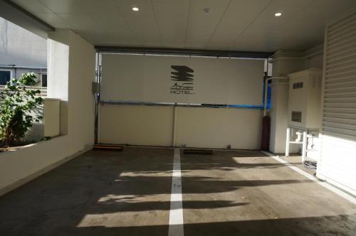 an empty garage with a large sign on the wall at Sodo Hotel Paju in Paju