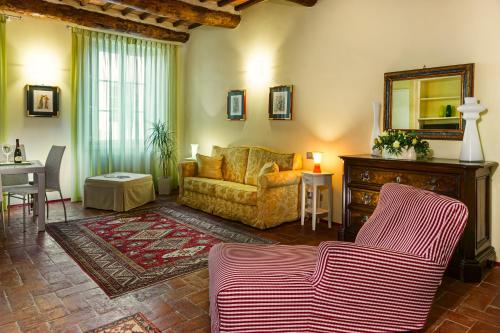 a living room with a couch and a table at Antica Residenza Dell'Angelo in Lucca