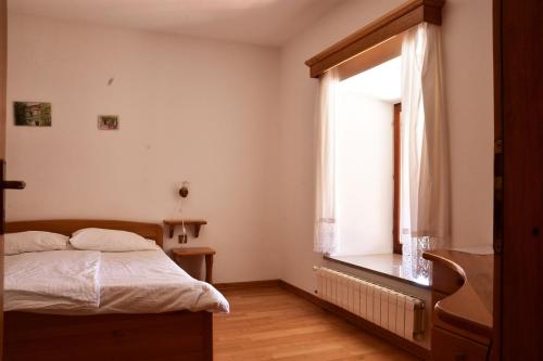 Ένα ή περισσότερα κρεβάτια σε δωμάτιο στο Tourist Farm Škerlj