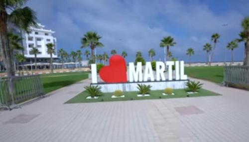 a sign for a beach with a red heart on it at Luxueux appartement avec vue sur mer à Martil in Martil