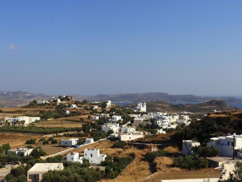 a view of a small town with white houses at In Alto holiday home in Plaka Milos in Plaka Milou
