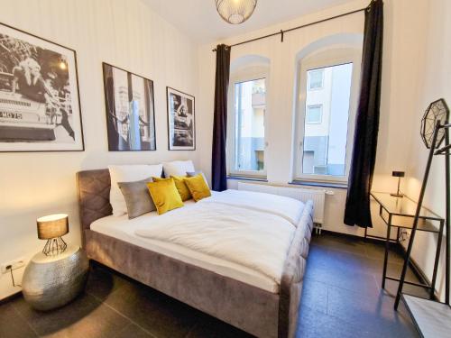 Postel nebo postele na pokoji v ubytování EUPHORAS - Hochwertiges Apartment in zentraler Lage
