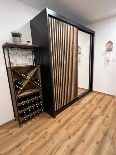 a room with a wine cellar with a mirror at Apartmán Víšek in Jáchymov