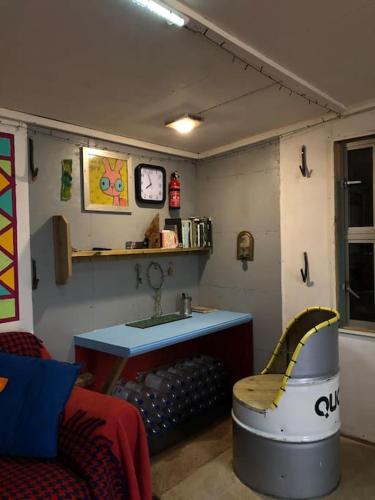 a living room with a sink and a bath tub at Secret Woodland Hideaway for two in Ilfracombe