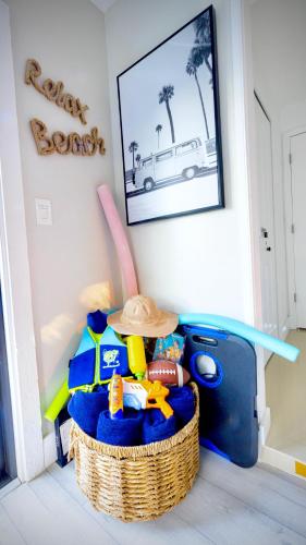 a toy room with a basket of toys and a hat at Private Heated Pool Oasis Pet-Friendly Retreat Short or long Stays Sleeps 2-8 Ppl in Pompano Beach