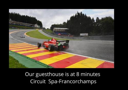 a picture of a race car on a race track at Paddock Lodge - Suites Wellness & Chambres d'hôtes in Stoumont