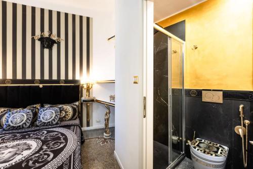 a bedroom with a bed and a shower at Le Stanze del Principe in Genova
