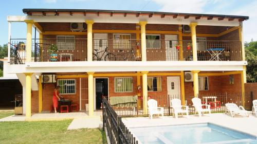 a house with a pool in front of it at LOS BULGAROS in Villa Cura Brochero