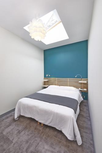 Postel nebo postele na pokoji v ubytování Appartements Rue Lemoine XXL