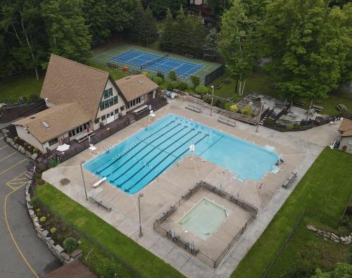 an overhead view of a large swimming pool at Indoor Pool, Firepit, Self Check-in, BBQ, FREE Amenities, KING Bed, Full Kitchen in Lake Ariel