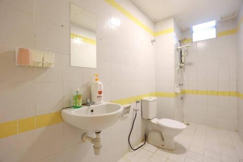 a bathroom with a sink and a toilet at Cyberjaya Cyberia landed house BBQ By EC in Cyberjaya